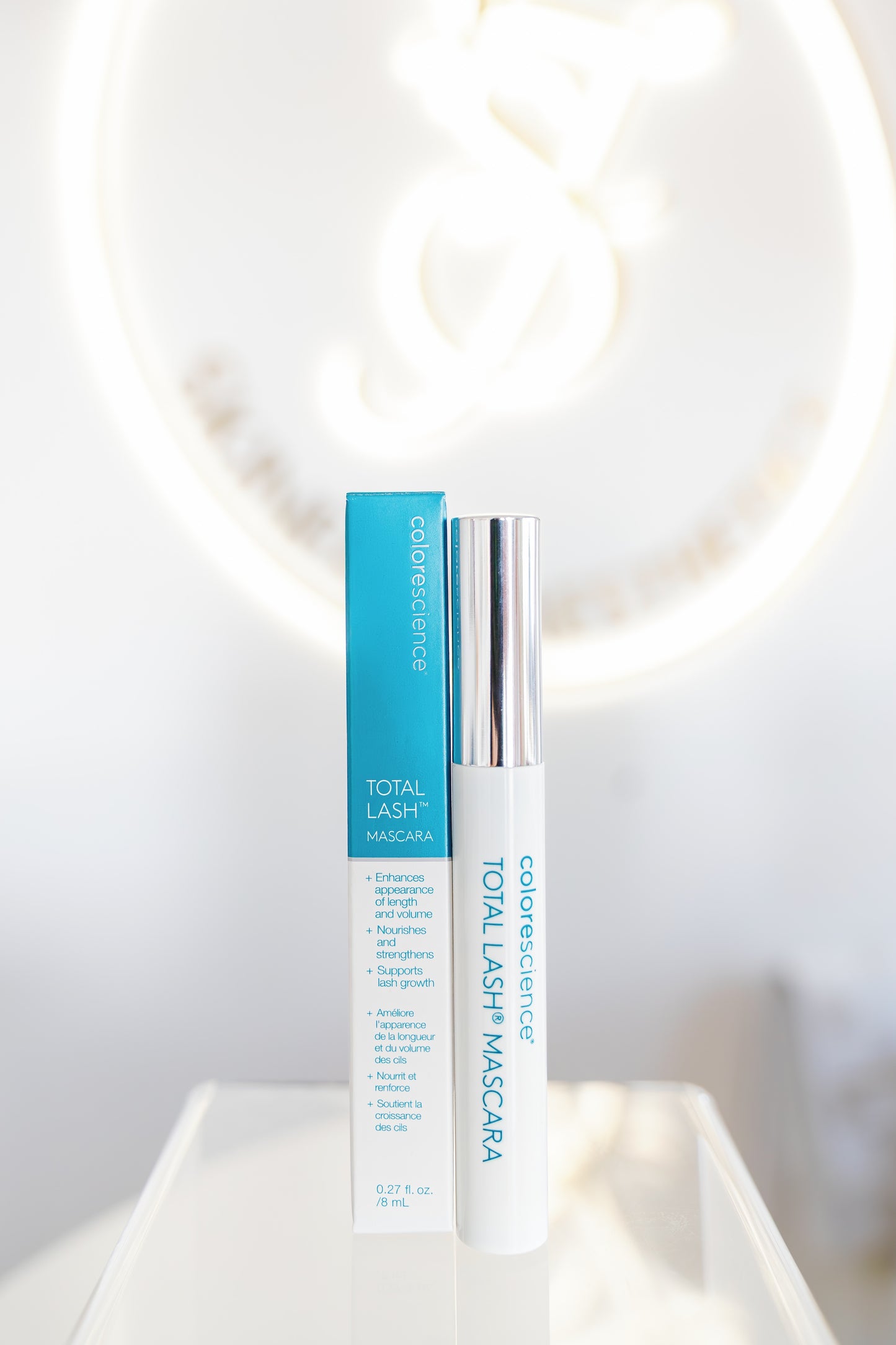 Cosmetics with blue and white packaging on a light background