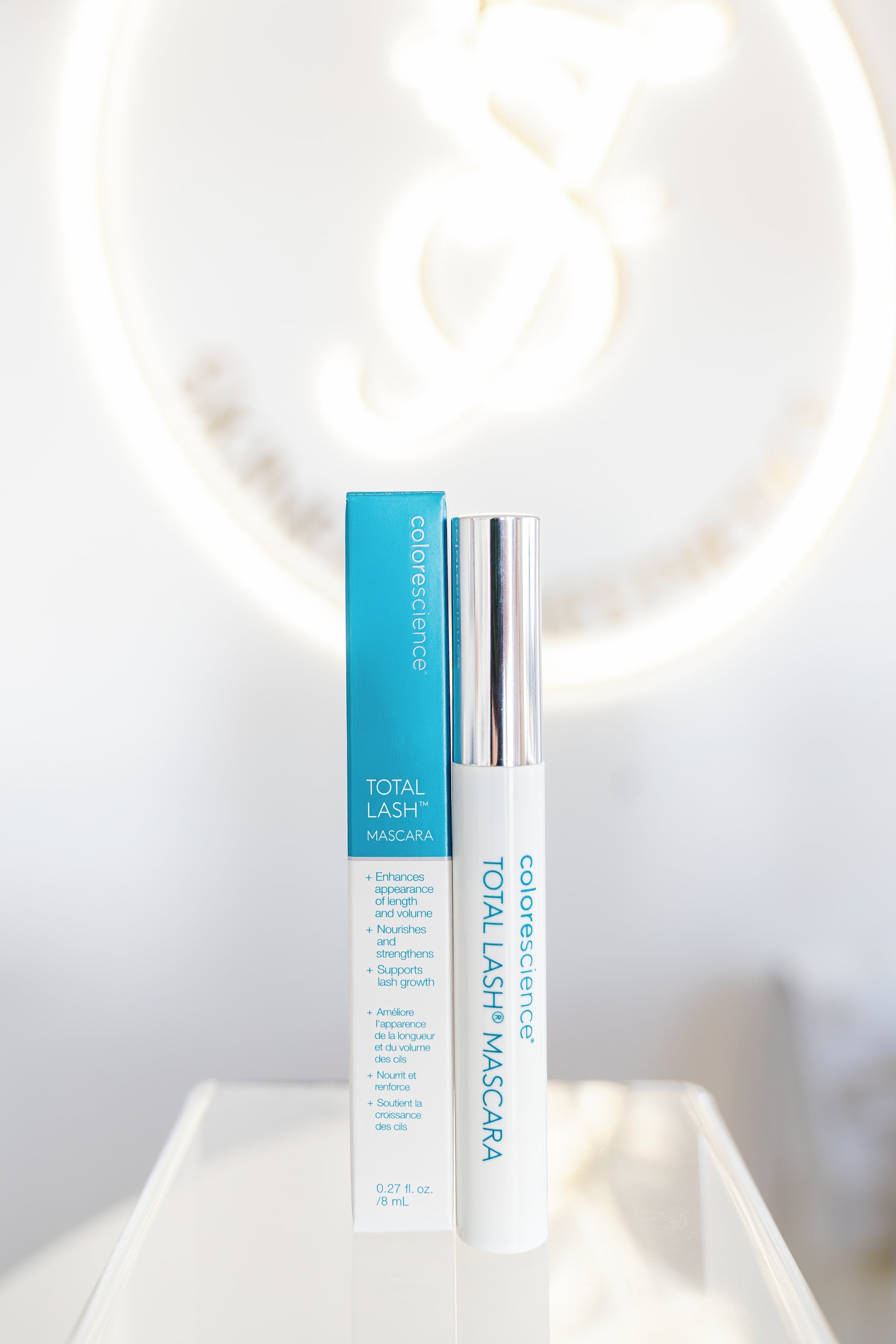 Cosmetics with blue and white packaging on a light background